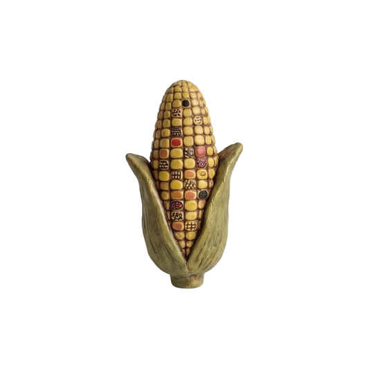 Folk art ear of corn with patterned kernels and green husk