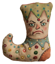 Whimsical fabric jester stocking with painted face and colorful dots
