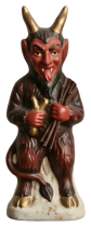 Vintage red Krampus devil figurine with horns and long tongue