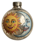 Vintage round ornament painted with smiling sun and crescent moon faces